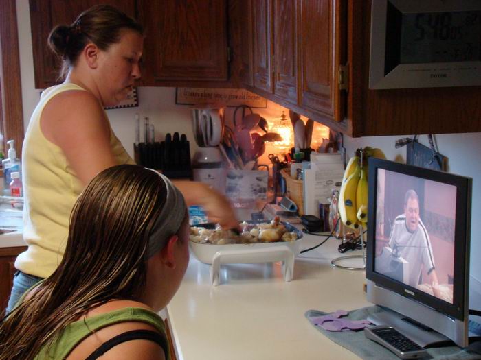 julie and megan in the kitchen cook'n noodles