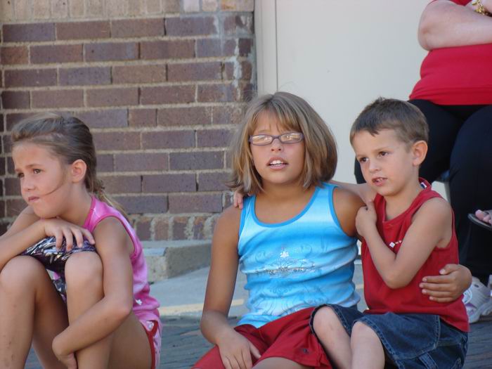 kayleen, holly and kyle waiting for the parade....